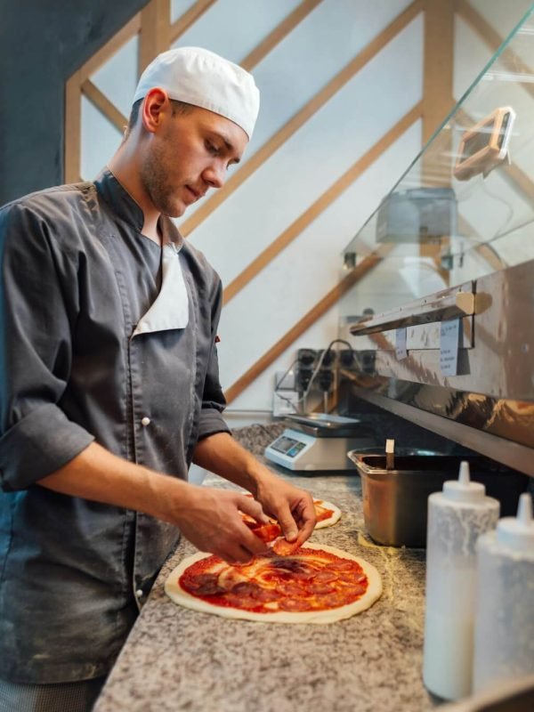 the-chef-prepares-pizza-catering-kitchen-work-.jpg